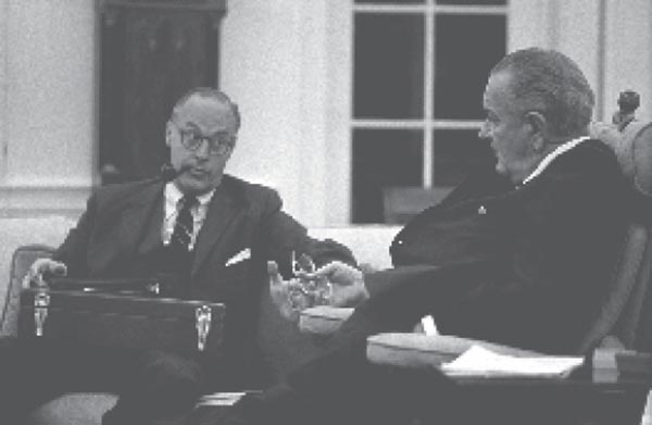 President Lyndon B. Johnson meeting with Robert Komer in the Oval Office.